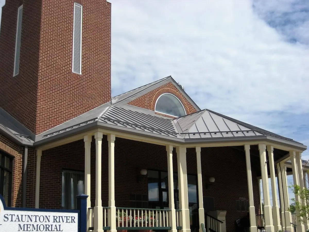Skilled roofing craftsmen working on a residential roof in Deweyville